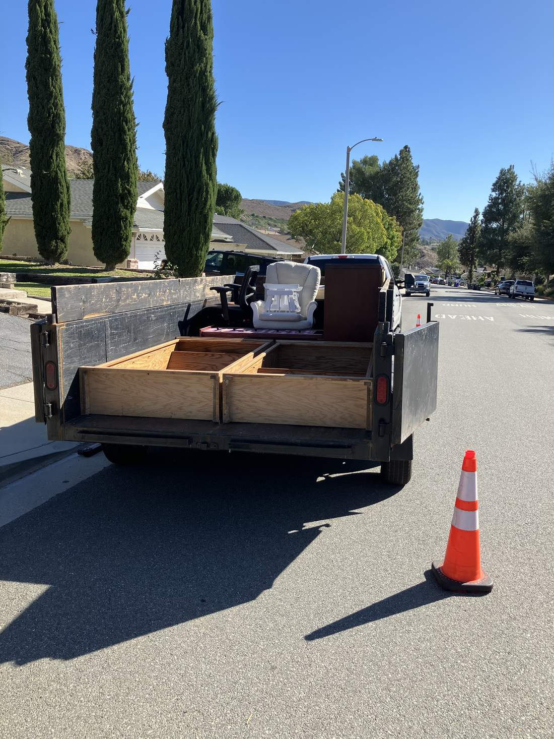 818 Junk trailer loaded with furniture on a San Fernando Valley job